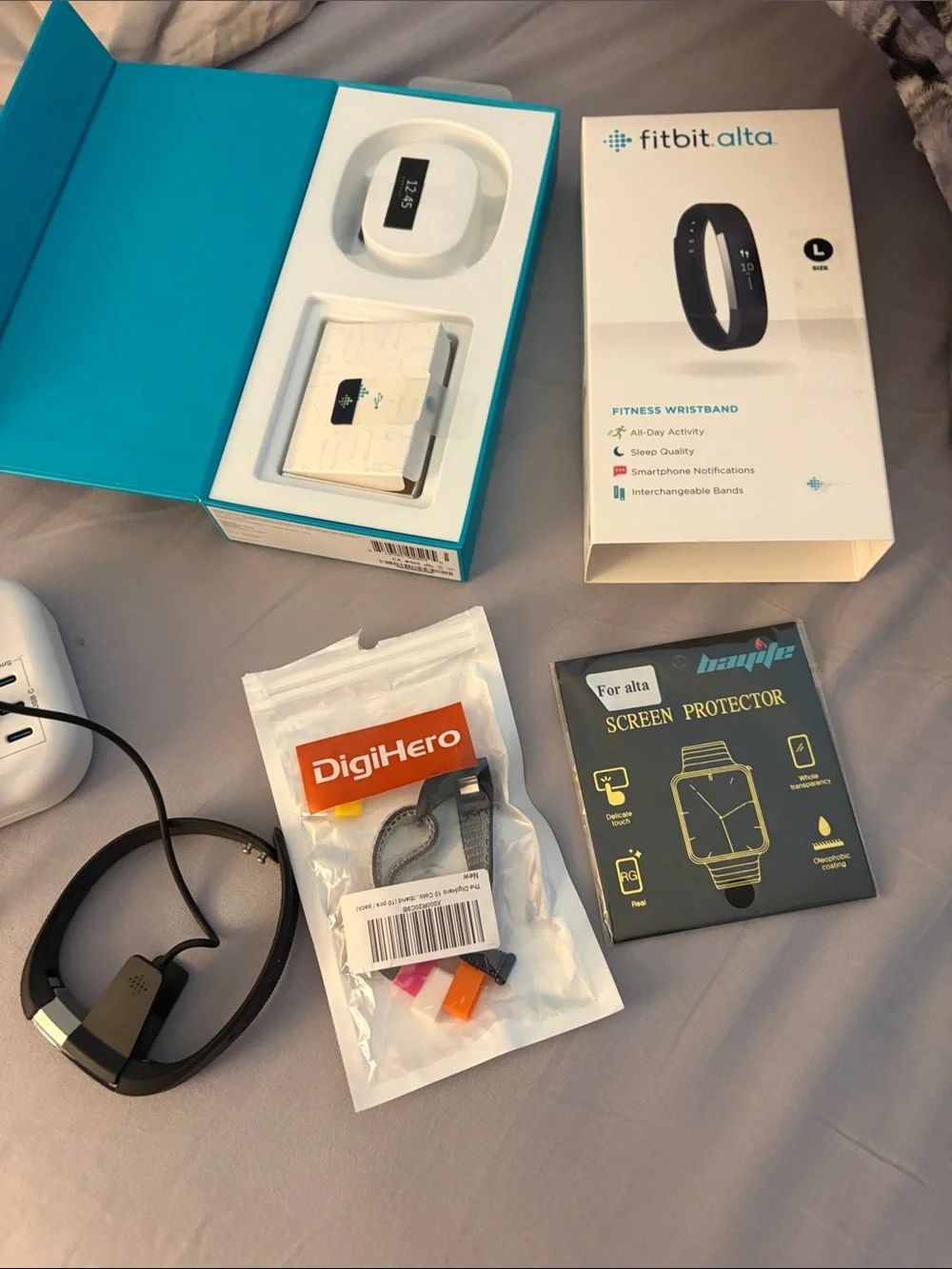 fitbit Alta black fitness wristband with accessories